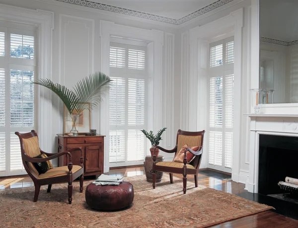 Formal living room with floor-to-ceiling plantation shutters
